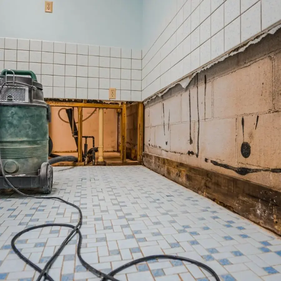 Flood cut drywall and an extraction unit during a Cordova sewage backup cleanup